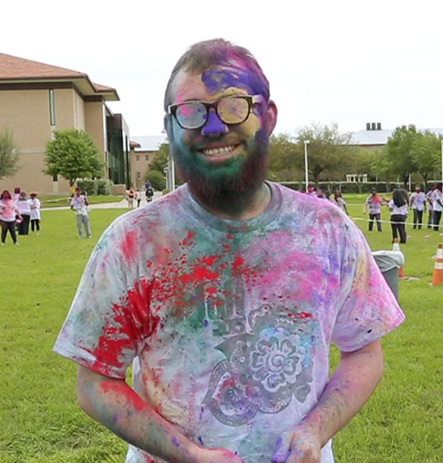 Male TAMIU student at Holi Festival