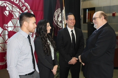 TAMIU President Dr. Arenaz with students.