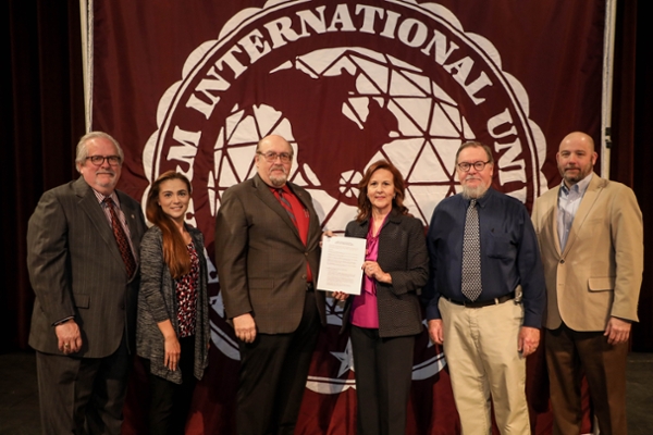 Celebrating the signing of the MOU between TAMIU and the Laredo Theater Guild International are, left to right:  Dr. Tom Mitchell, TAMIU Provost;  Dr. Claudia San Miguel, Dean, College of Arts & Sciences; Dr. Pablo Arenaz, president; Linda Lopez Howland, president, LTGI; Dr, Blake Carroll, LTGI; and Chris _____, LTGI.