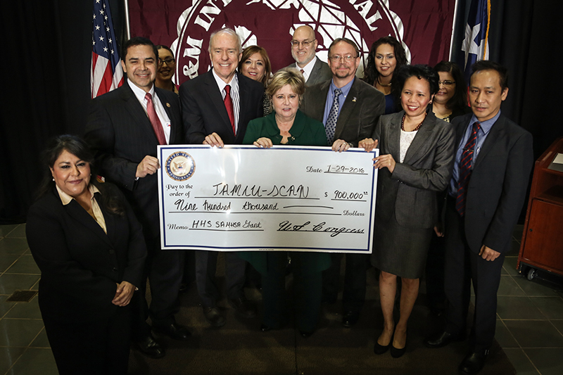 Pictured from left to right are, on front row: Maria Del Rosario Benavides, TAMIU program coordinator; Congressman Cuéllar; Dr. Keck; Dr. Glenda Walker, dean of TAMIU College of Nursing and Health Sciences and Dr. F.M. Canseco School of Nursing; Dr. Christopher Craddock, vice president of SCAN; Dr. Marivic Torregosa, TAMIU assistant professor of nursing and coordinator of the Family Nurse Practitioner program for the College of Nursing and Health Sciences; and Dr. Marcus Antonius Ynavlez, TAMIU associate professor of sociology. Pictured on the second row are: Lorena Guevara, SCAN interventions specialist; Dora Ramírez, SCAN grant project supervisor; Dr. John Kilburn, TAMIU associate dean of Research; Melissa Mendoza, SCAN interventions specialist; and Dr. Elizabeth Terrazas-Carrillo, TAMIU assistant professor in the Department of Psychology and Communciation.