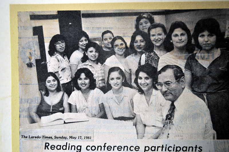 Dr. Hinojosa is photographed with fourteen individuals.