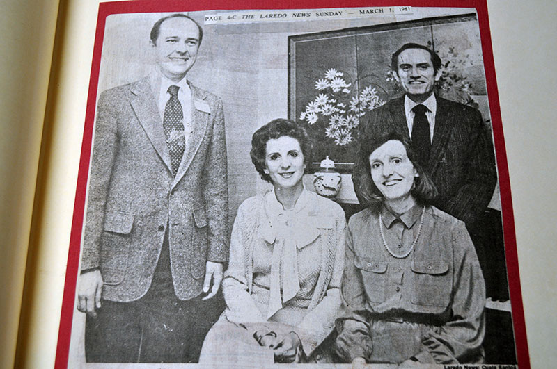 Dr. Ray Keck and E.H. Corrigan are photographed with two women after a discussion.