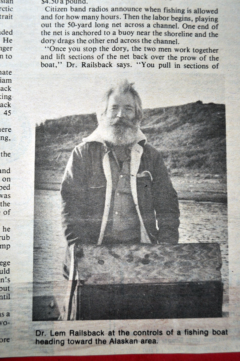 Dr. Lem Railsback at the controls of a fishing boat heading toward the Alaskan area.