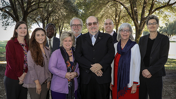TAMIU president Dr. Pablo Arenaz welcomes TAMIU's academic leadership team including, left to right, front: Dr. Jennifer Coronado, dean, the Graduate School; Dr. Claudia San Miguel, dean, College of Arts & Sciences; Dr. Glenda Walker, dean, College of Nursing and Health Sciences; president Arenaz; Dr. Catheryn Weitman, dean, University College and Dr. Lynne Manganaro, interim chair of the department of Social Sciences. Back row, left to right, Dr. Peter F. Haruna, associate dean of the College of Arts & Sciences; Dr. Tom Mitchell, provost and vice president for Academic Affairs, and Dr. John Kilburn, associate vice president of the Office for Research and Sponsored Projects.  Not pictured, dean of the A. R. Sanchez, Jr. School of Business, Dr. Stephen Sears, and Dr. James O'Meara, dean of the College of Education.