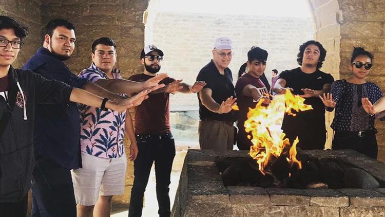 TAMIU students enjoy a nice fire during the Baku trip.