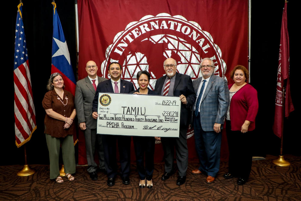 Left to right at the grant announcement at TAMIU are Celeste E. Kidd, TAMIU research associate; Dr. John Kilburn, associate vice president of Research and Sponsored Projects; Congressman Henry Cuellar; Dr. Marivic Torregosa, interim dean, College of Nursing and Health Sciences; Dr. Pablo Arenaz, president; Dr. Tom Mitchell, provost and vice president for Academic Affairs and Dr.  Rose A. Saldivar, TAMIU Dr. F. M. Canseco School of Nursing clinical assistant professor.