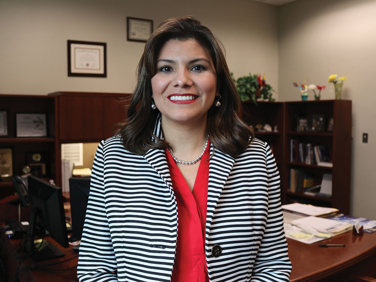 Mayra Hernandez in front of her office.