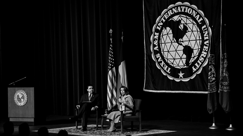 The Honorable Speaker of the U.S. House of Representatives, Nancy Pelosi, speaks on stage with U.S. Congressman Henry Cuellar.