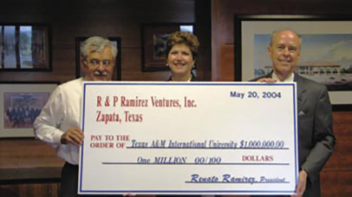 Renato and Patricia Ramirez with Dr. Keck holding the donation check.