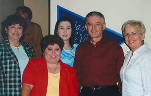Nicola Lanese '80 celebrates his retirement with a group of colleagues