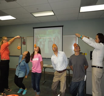 ESL Halloween presentation, students playing the game Sticky Face