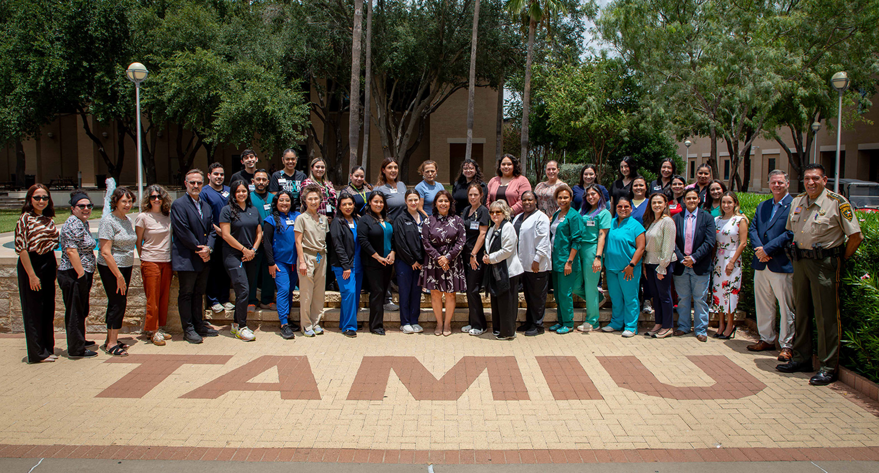 Nursing SANE participants posing infront of TAMIU Outdoor Fountain