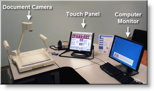 Example of an instructor podium with touch panel, document camera and computer monitor.