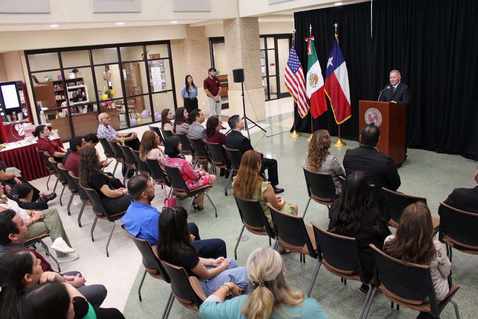 Group of people at the launch of Binational Art Exhibit