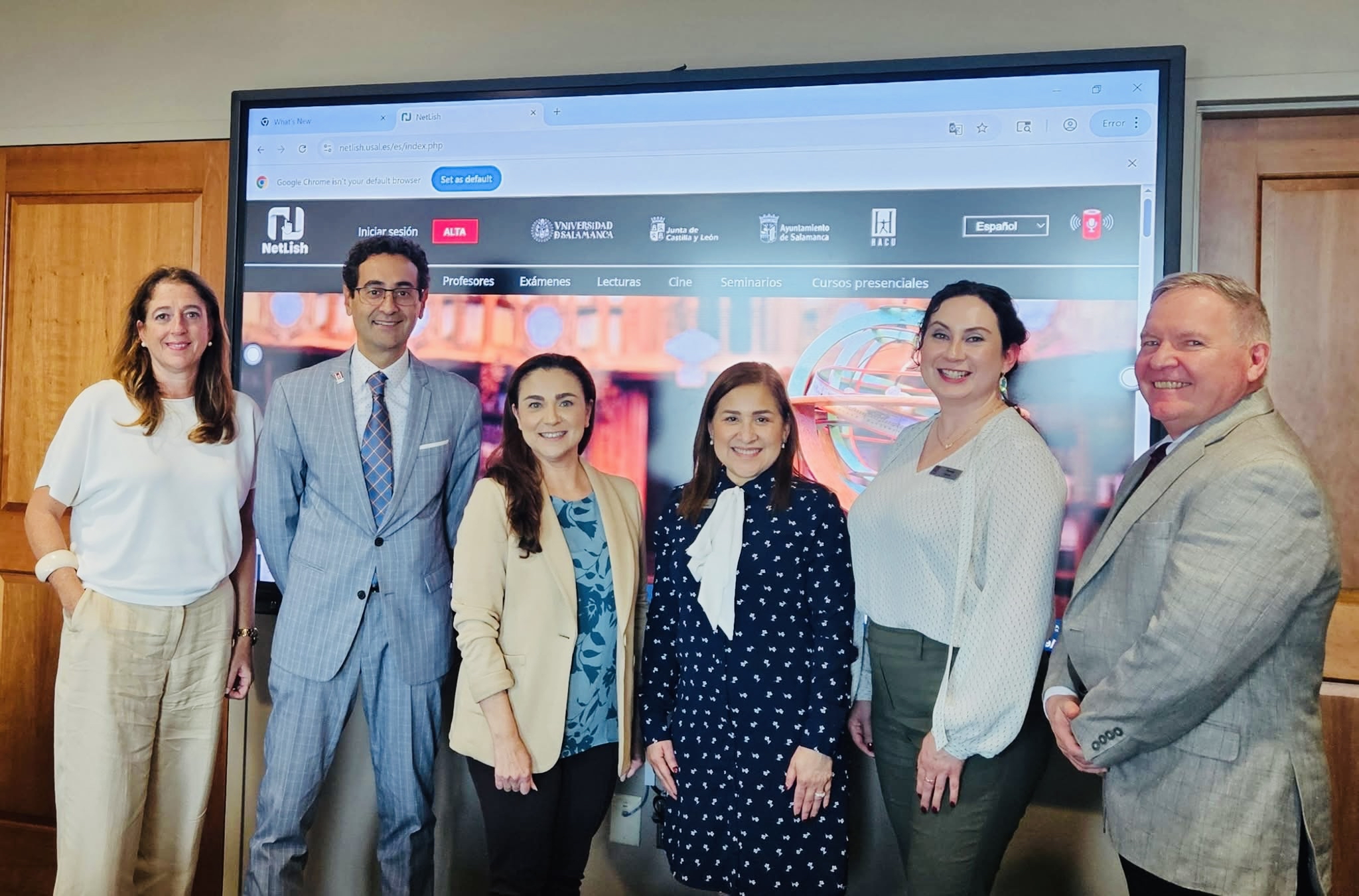 Visitors and GCE Program Manager on golf cart in front of FPA building