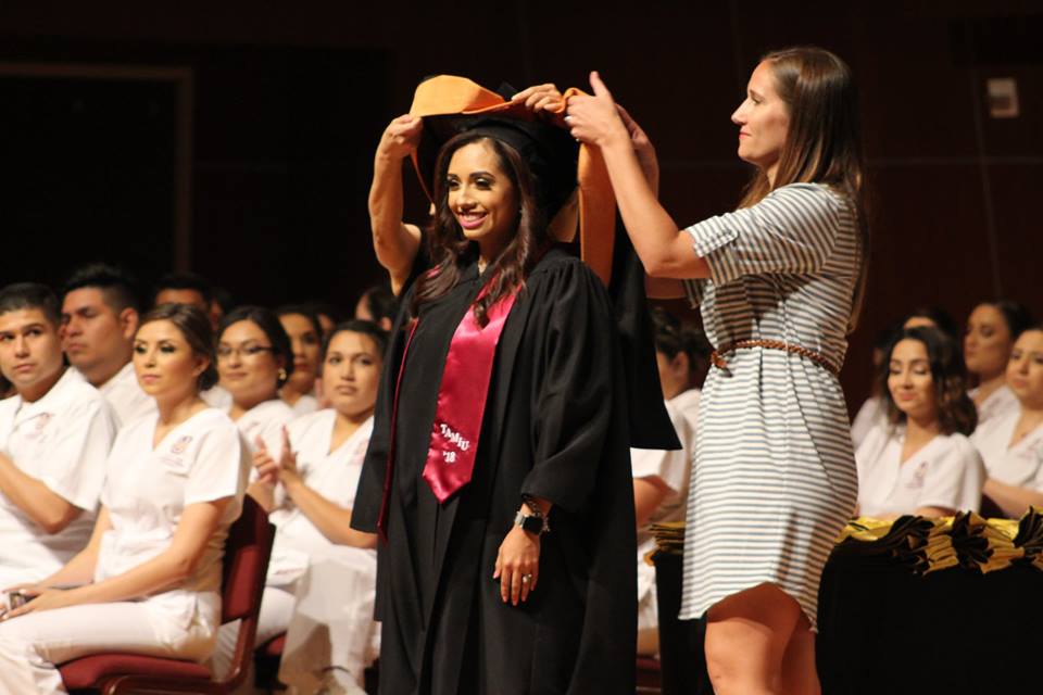 Nursing Graduate Student hooded by Program Advisor.