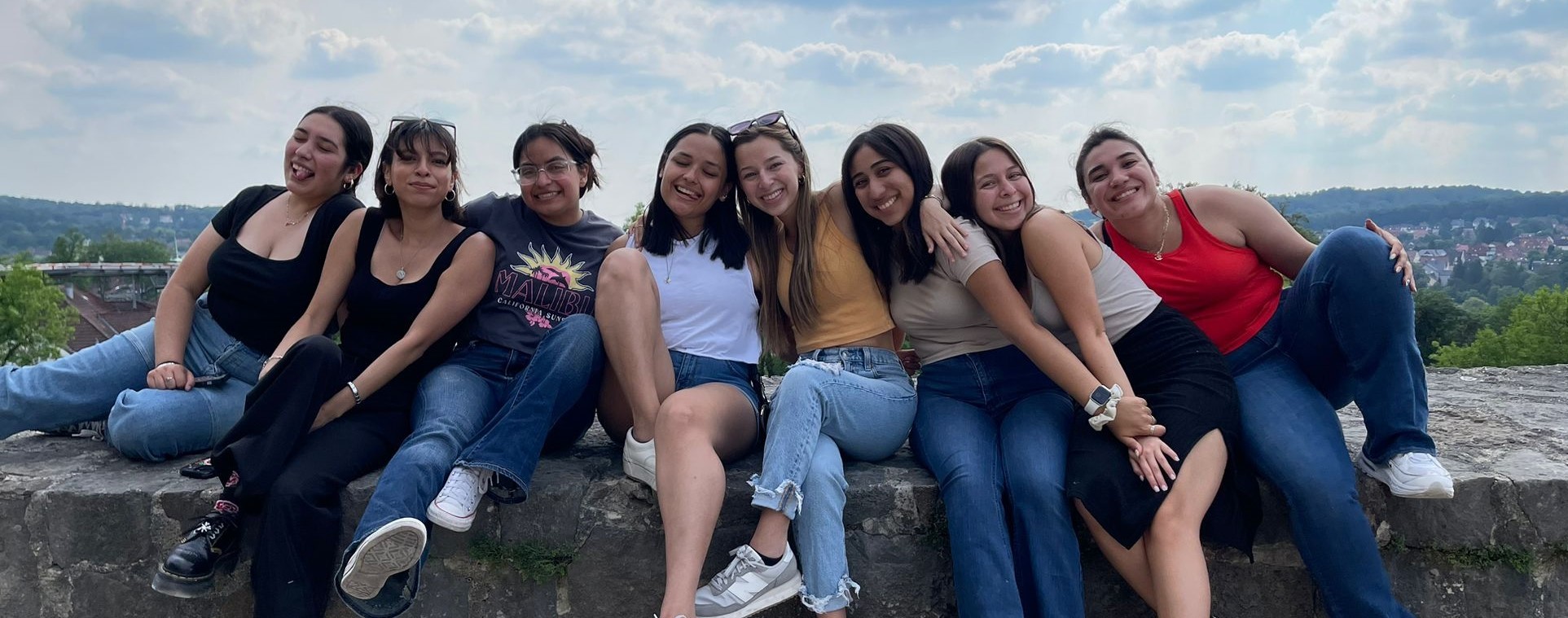 Group of students with mountains of Peru in the background