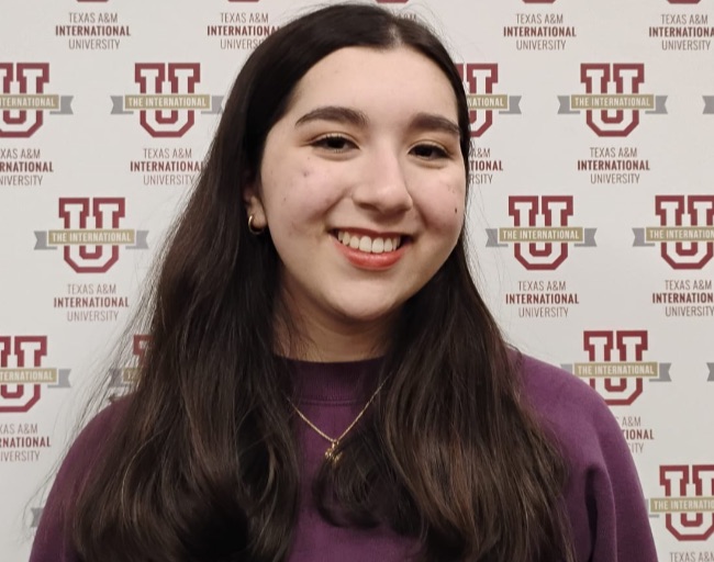 TAMIU intern smiling at camera