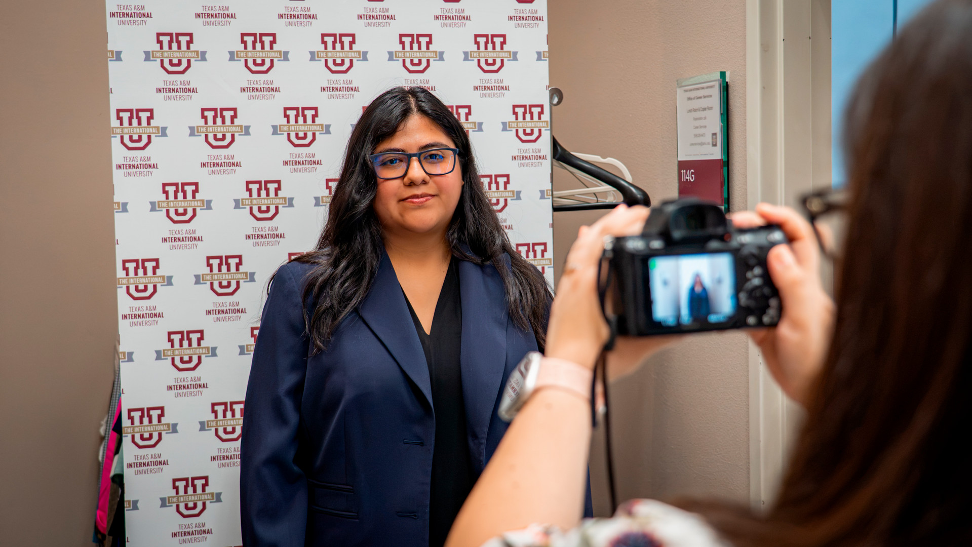 students taking a headshot 
