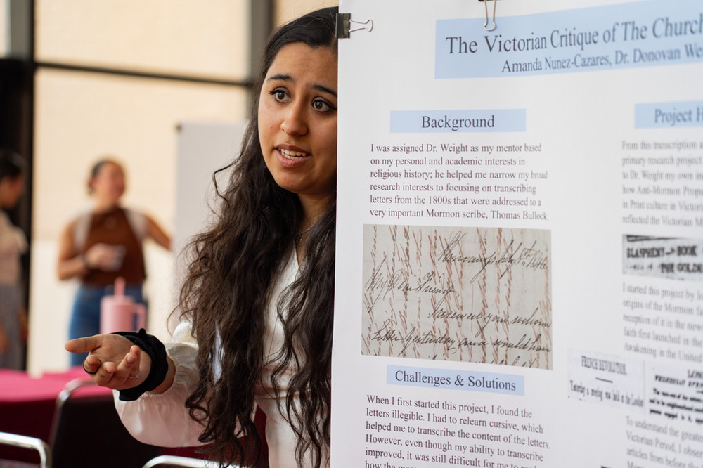 student presenting professional poster