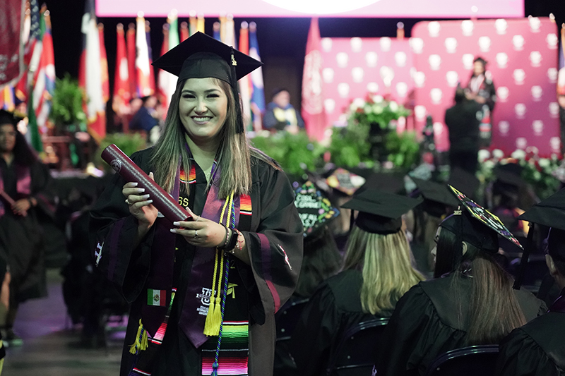 TAMIU Graduation Candidate walking the stage during Spring 2022 Commencement Exercises