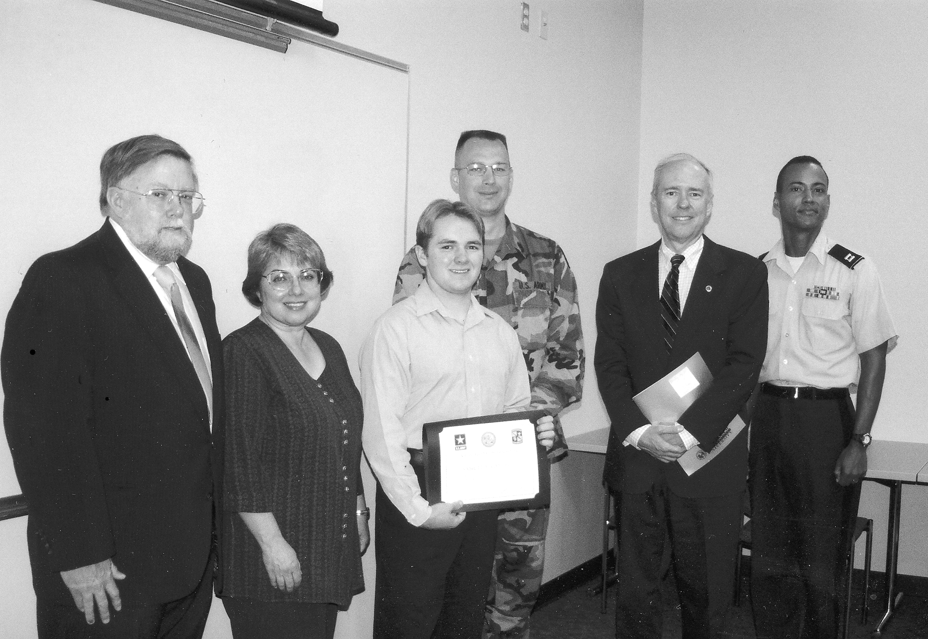 Samuel Cantrell pictured with his parents and University representatives