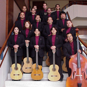 TAMIU Classical Guitar Ensemble pictured on staircase with their instruments