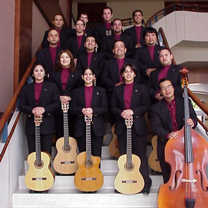 TAMIU Classical Guitar Ensemble pictured on staircase with their instruments