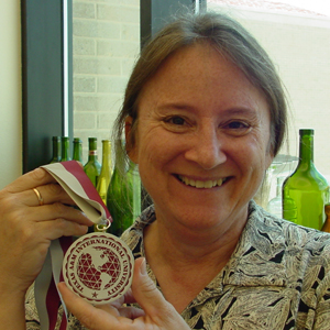 Janet Krueger holding her Scholar of the Year award