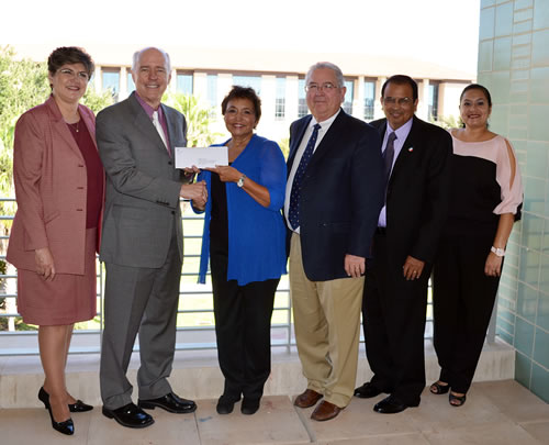 Left to right are Candy Hein, TAMIU vice president for Institutional Advancement; Dr. Ray Keck, TAMIU president; Tina Treviño, CIS Board member; Larry Dovalina, CIS Board chair; Zaragoza Solis, CIS financial coordinator and Sandy Salinas, CIS program manager.