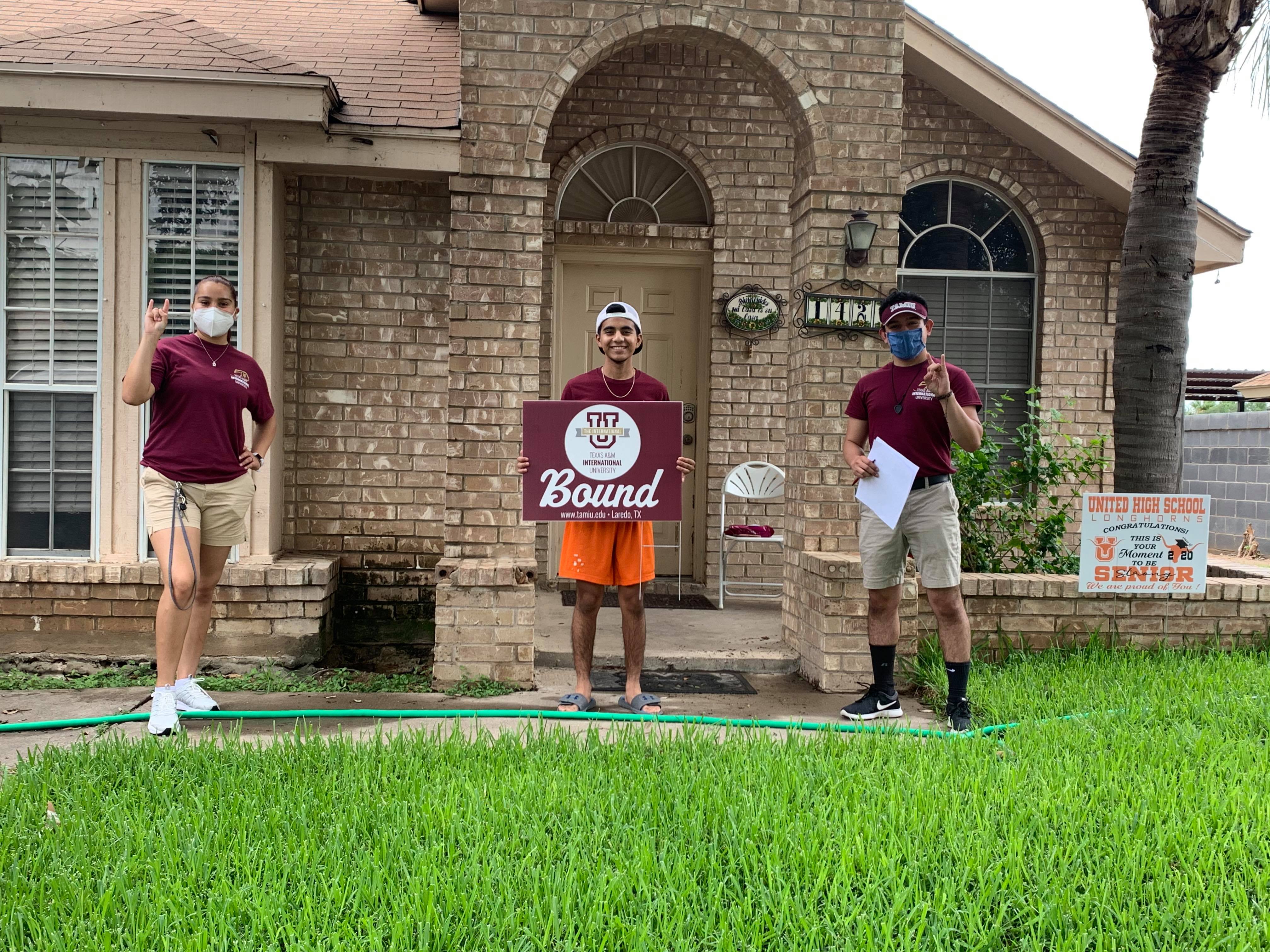 Orientation Leaders welcome a newly admitted freshmen in the comfort of his home.