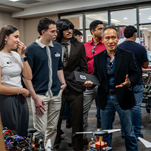 Dr. Marcus Ynalvez with Students at the Apex Symposium