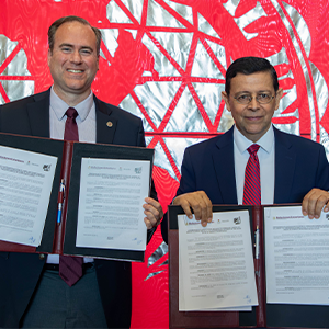 Dr. Maynard and Consul General Juan Carlos Mendoza Sánchez showing their newly signed MOU.