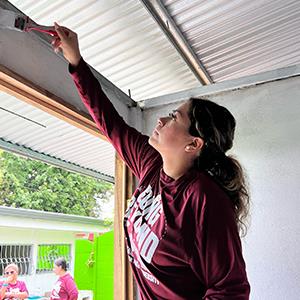 Girl Paints during Service Abroad Project