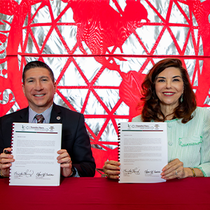 LC President and TAMIU Interim President holding Pathways signing.