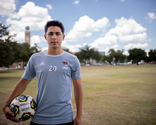 Student athlete standing in TAMIU soccer field