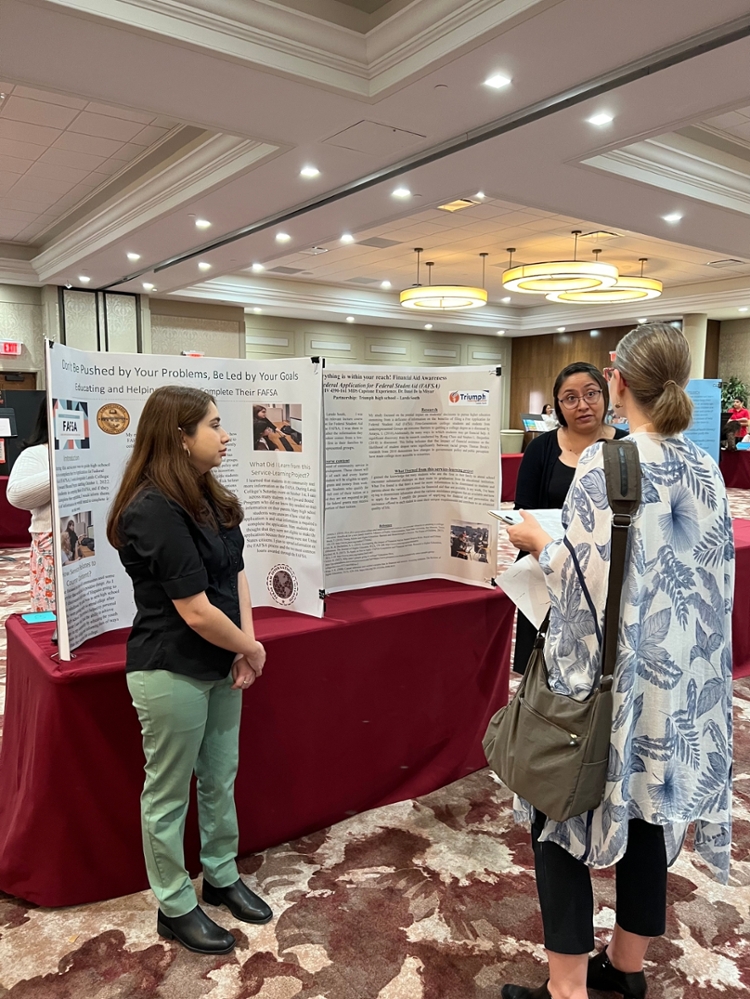 Students conferring over exhibit