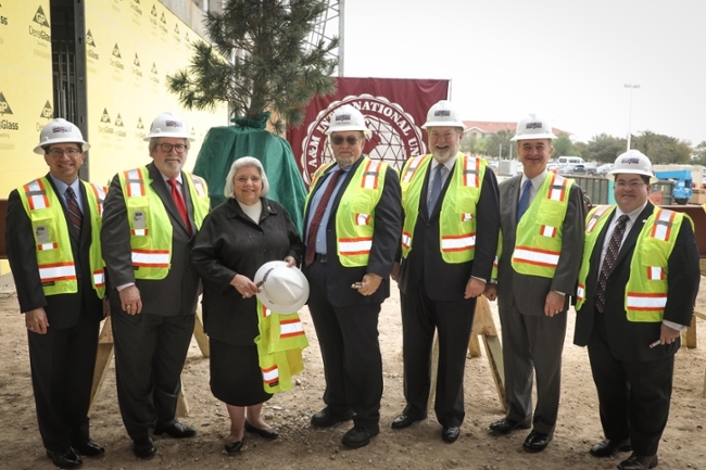 TAMIU's Topping-Off Ceremony celebrated a milestone with those who have helped to make the new Academic Hall and Laboratory a reality. Left to right, Juan Castillo, TAMIU vice president for Finance and Administration; Dr. Tom Mitchell, provost and vice president for Academic Affairs; State Senator Judith Zaffirini; TAMIU president Dr. Pablo Arenaz; chairman of The Texas A&M University System Board of Regents, Charles W. Schwartz; A&M System Chancellor, John Sharp, and Trevor Liddle, TAMIU associate vice president for Administration.