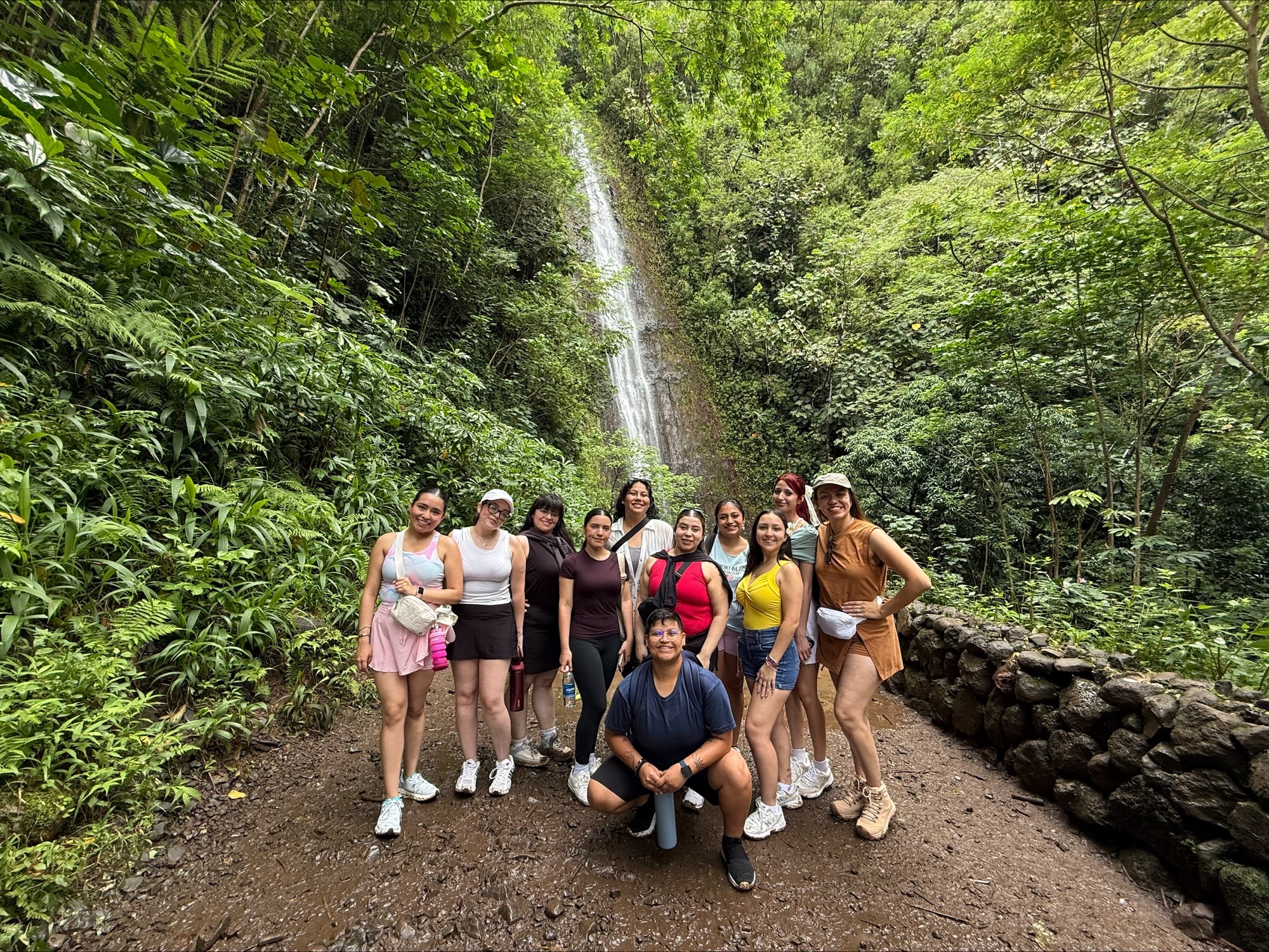 Students stand outside for an outdoor hike
