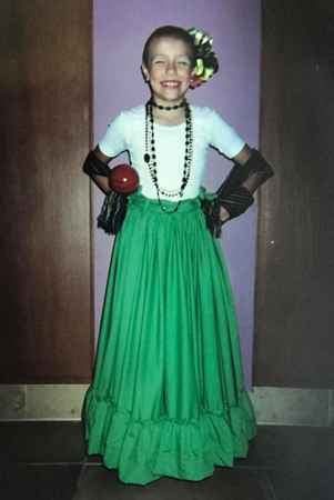 A young Lopez in a traditional Ballet Folkorico dress.