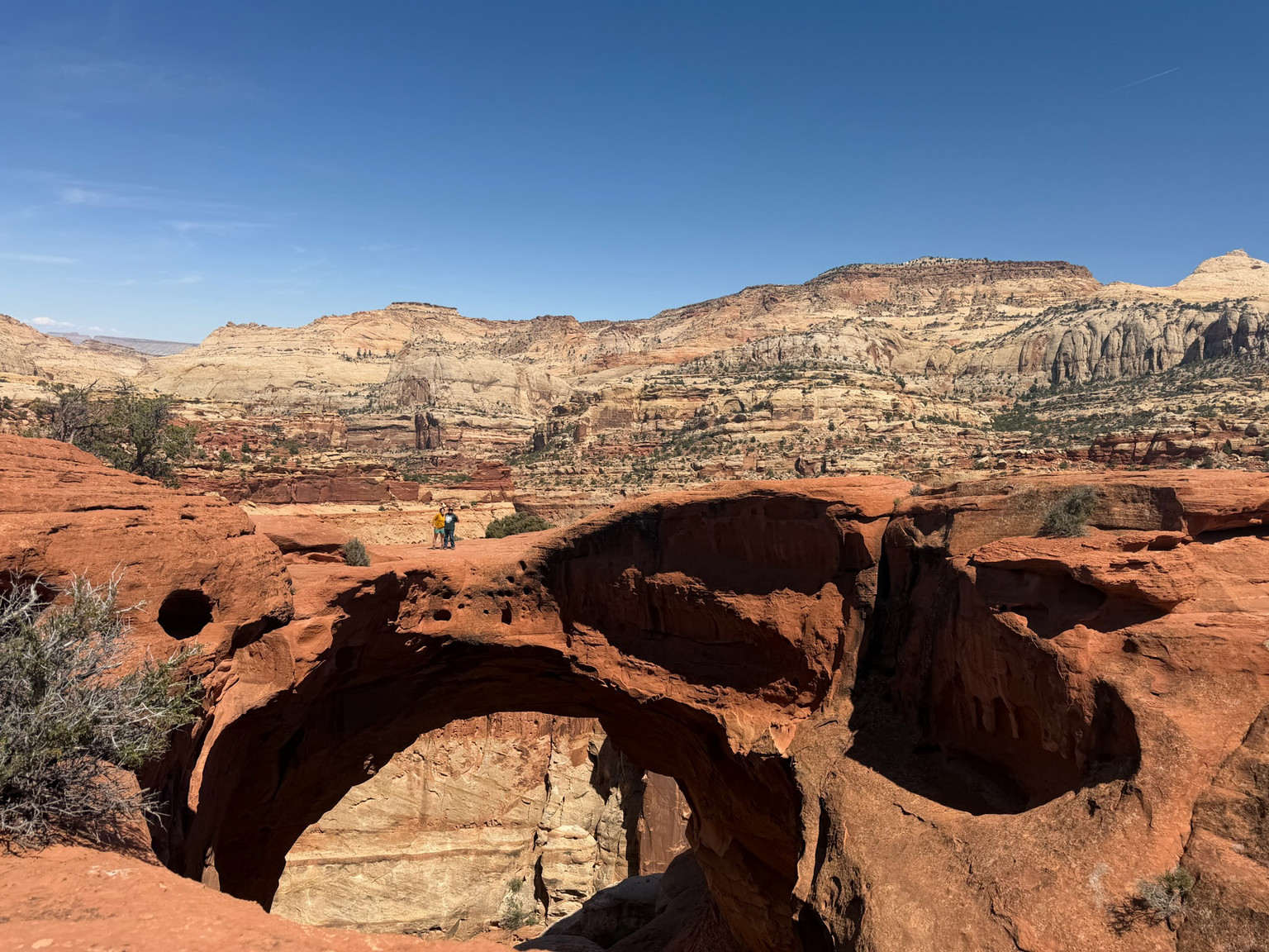 Triana Martinez stands along a large rock formation at the Capitol Reef National Park.