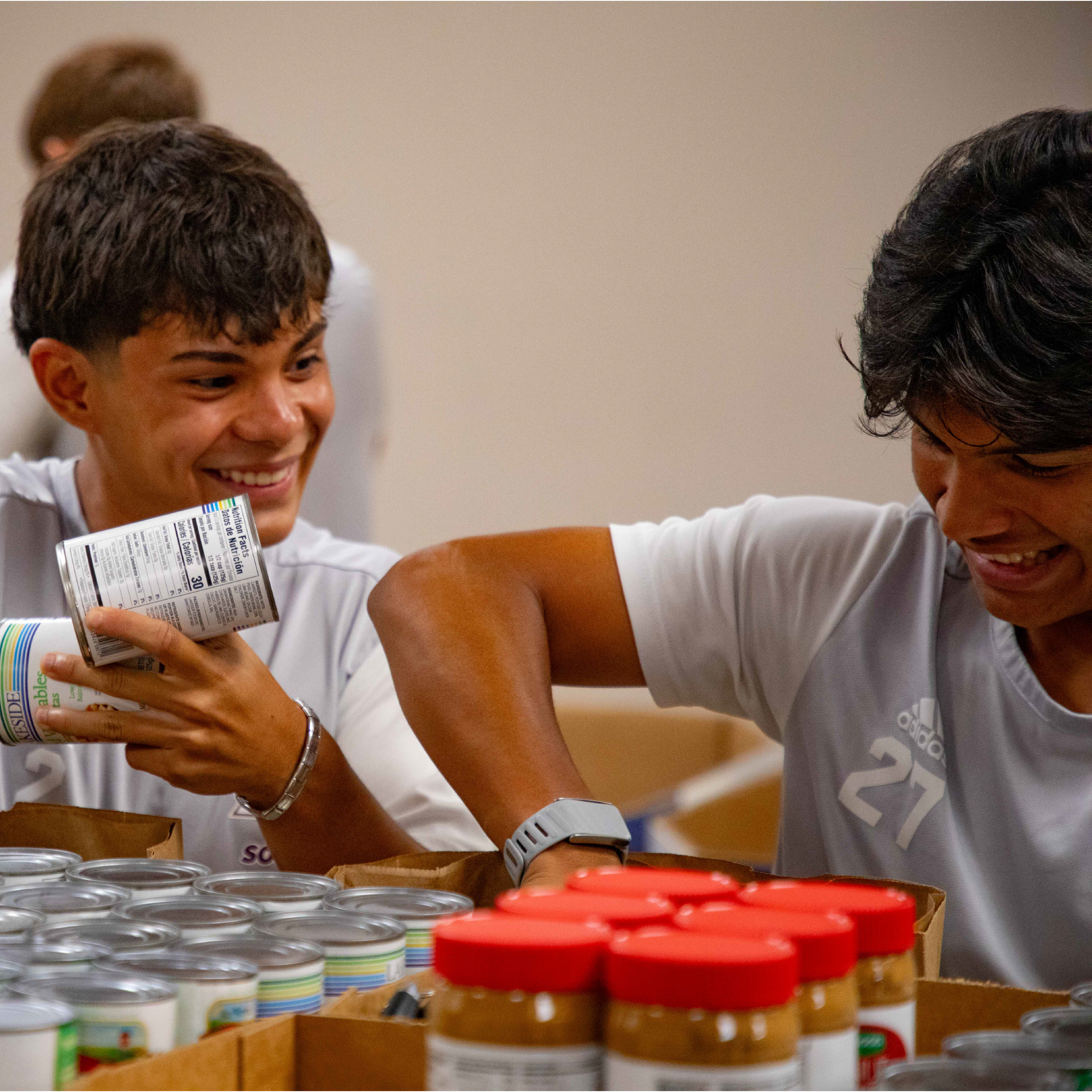 Student athletes volunteer at the South Texas Food Bank