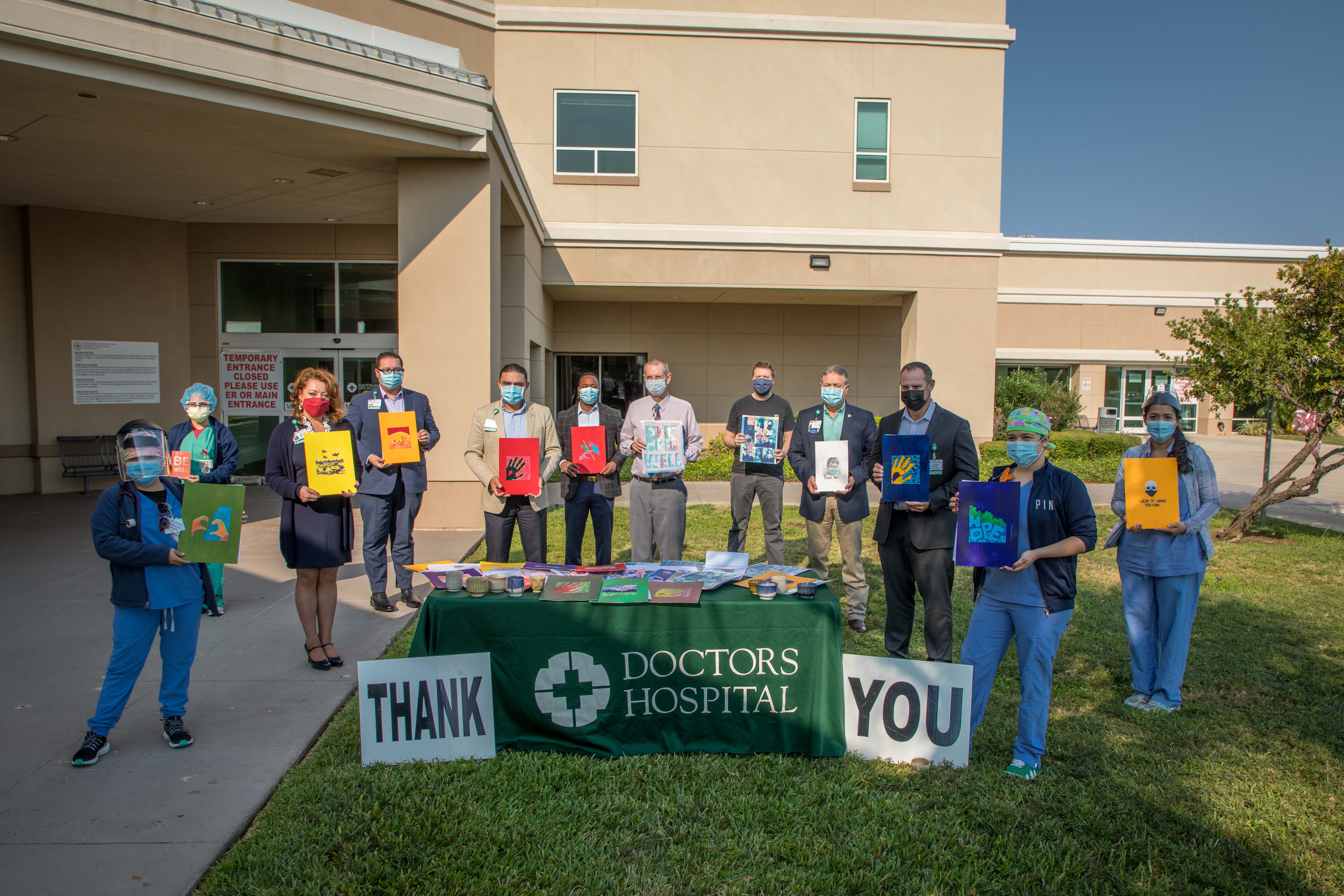 Members of the Doctors Hospital administrative team welcomed the donations in a special outdoors, socially distanced and masked event Friday, Oct. 2. The artwork was delivered by Dr. James Moyer and Jesse Shaw. 