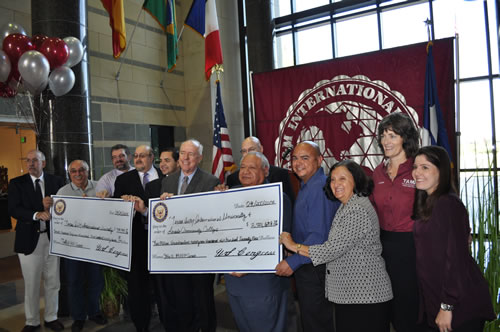 Officials of Texas A&M International University and Laredo Community College join Congressman Henry Cuellar Thursday for the announcement of federal grants totaling over $3.4 million.