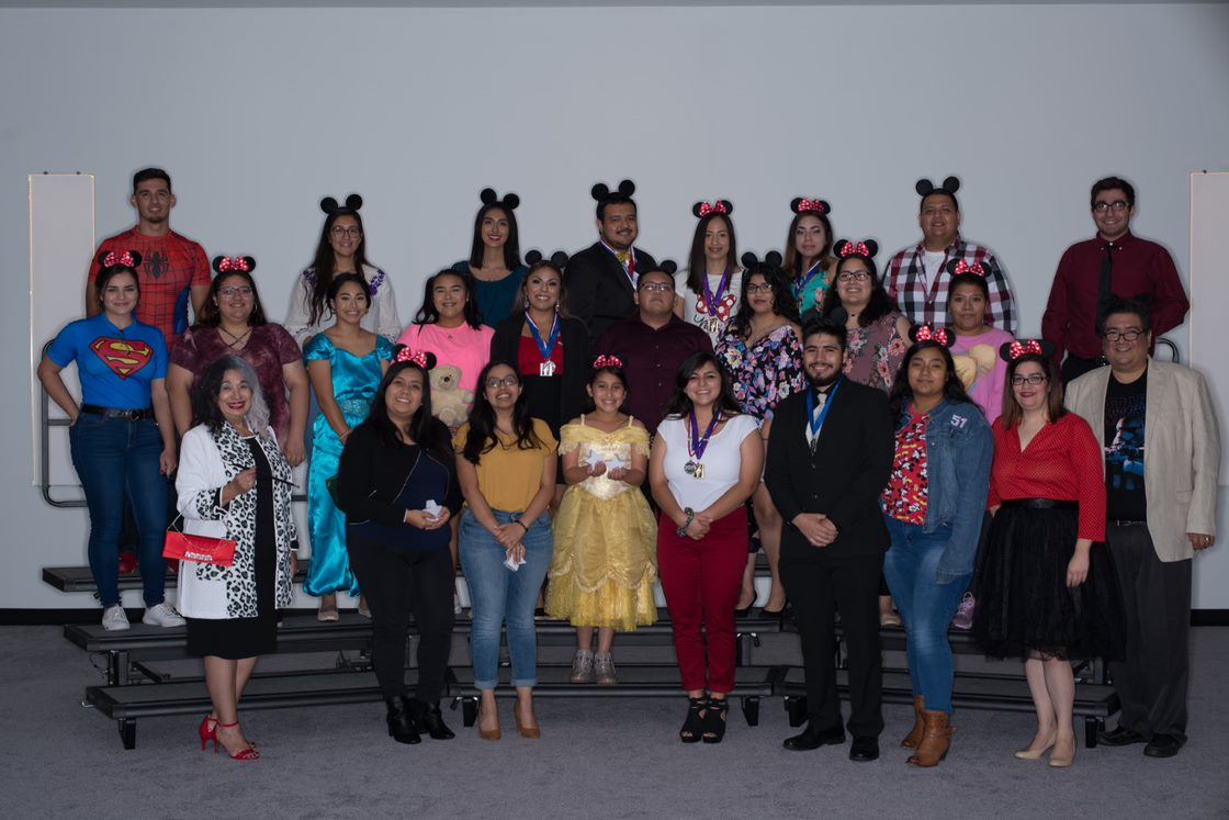 Awards dinner group picture with students in costume
