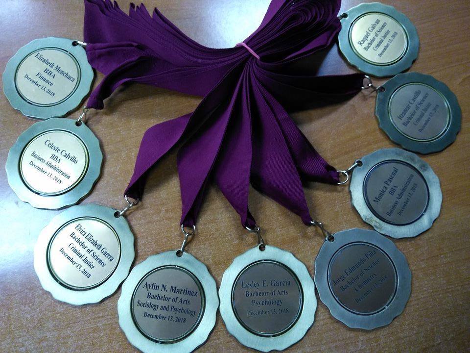 Nine medals arranged in a semi circle