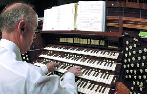 Dr. Keck seated at the Sharkey-Corrigan Pipe Organ