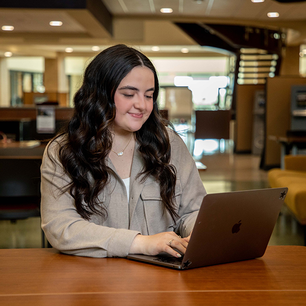 Cybersecurity Month, Student on a Laptop
